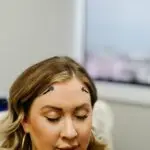 Client engaged in microcurrent neurofeedback