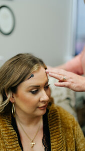 Image of female being prepped for an IASIS Mcirocurrent Neurofeedback session