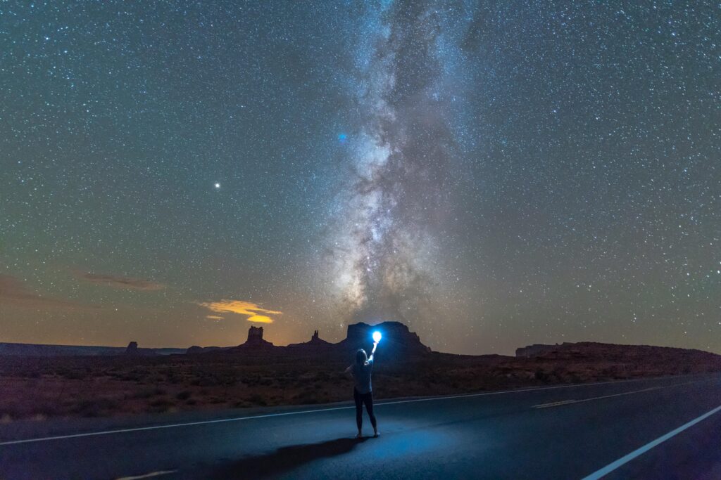A person standing at a fork in the road – representing decision-making and boundaries