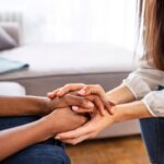 two people holding hands