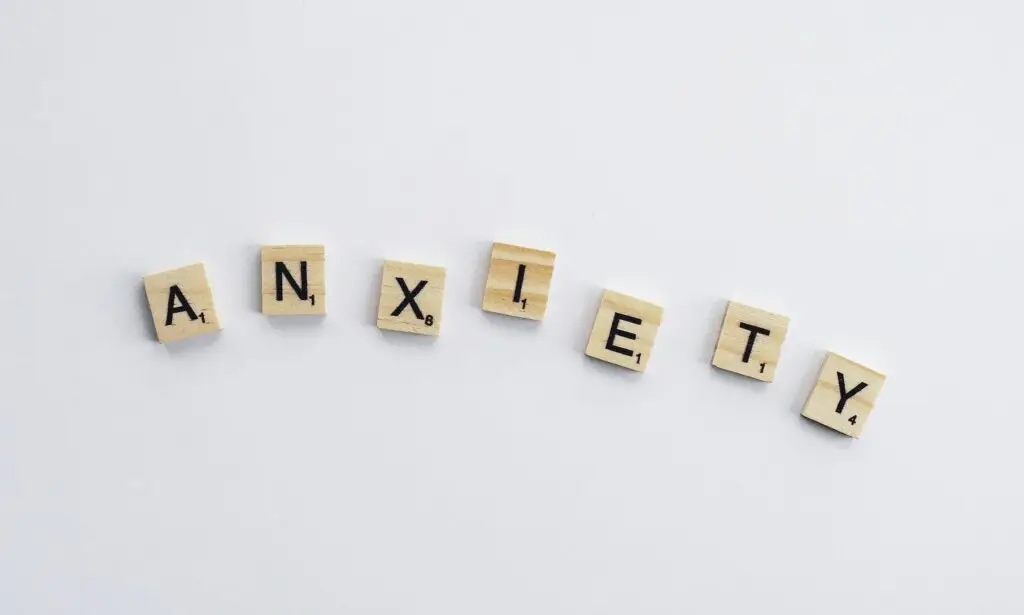 “Scrabble tiles spelling the word anxiety on a white background, symbolizing how high-functioning anxiety can be hidden in plain sight.”