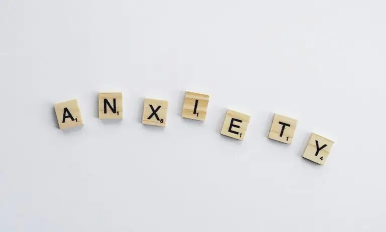 “Scrabble tiles spelling the word anxiety on a white background, symbolizing how high-functioning anxiety can be hidden in plain sight.”