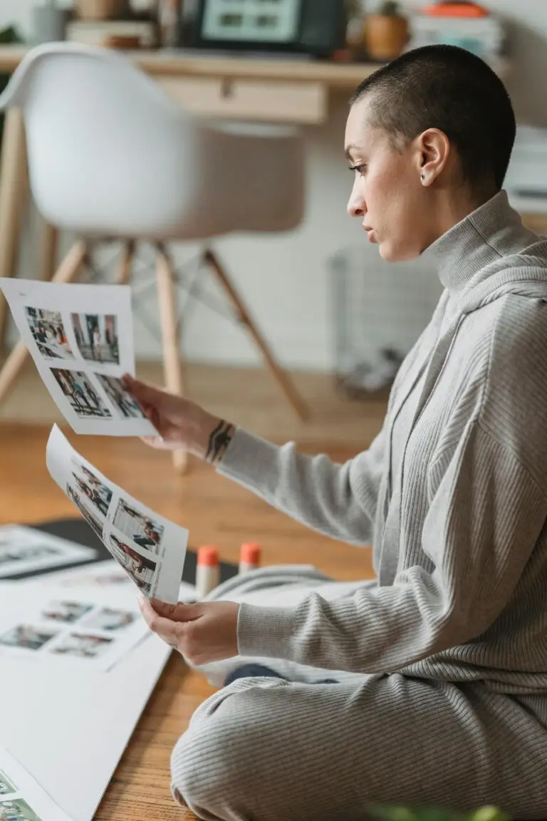 Person experiencing reduced productivity while reviewing work materials, reflecting mental fatigue, burnout, and the need for compassion and nervous system regulation